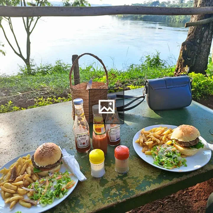 Two plates of burgers and fries