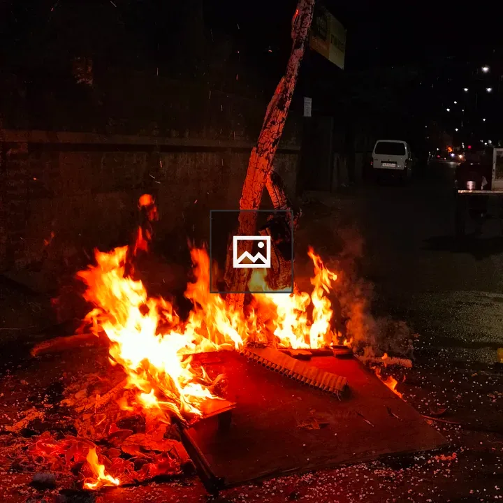 Fire in Street Debris at Night