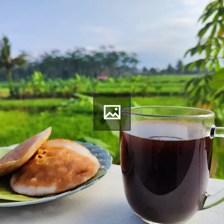 Glass cup of coffee with pastries