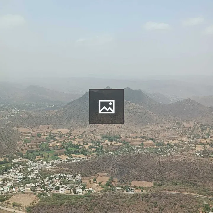Panorama of hilly landscape with village