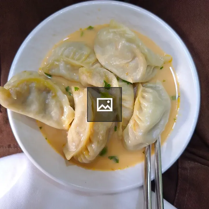 Dumplings in Creamy Orange Sauce