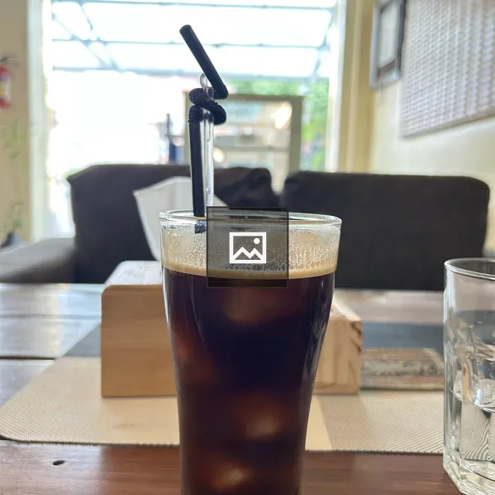 Iced coffee on wooden table