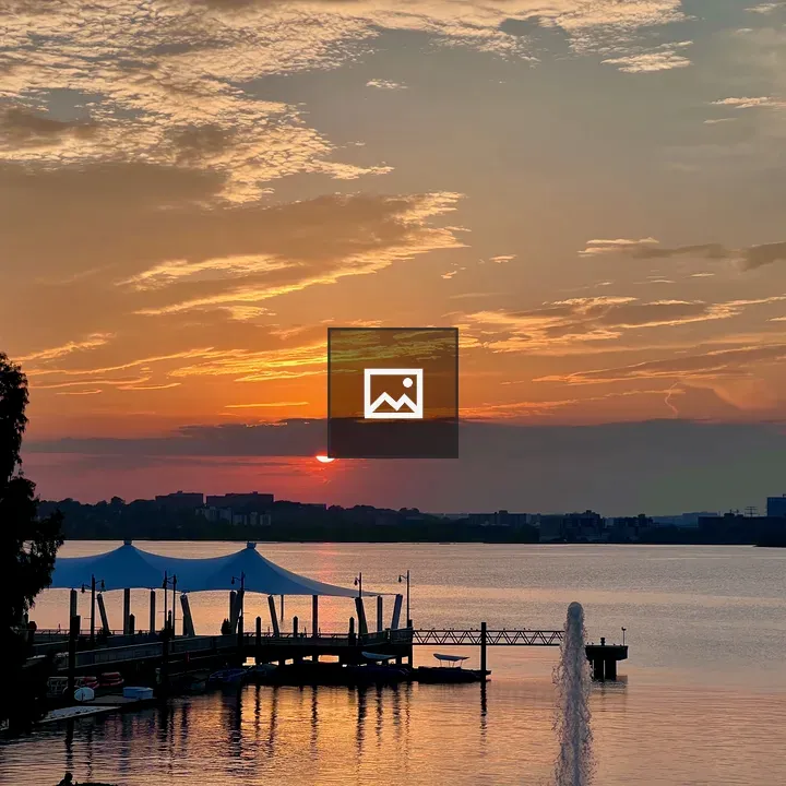 Sunset over water and boat