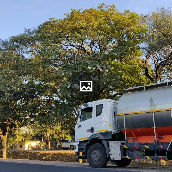White tanker truck on road