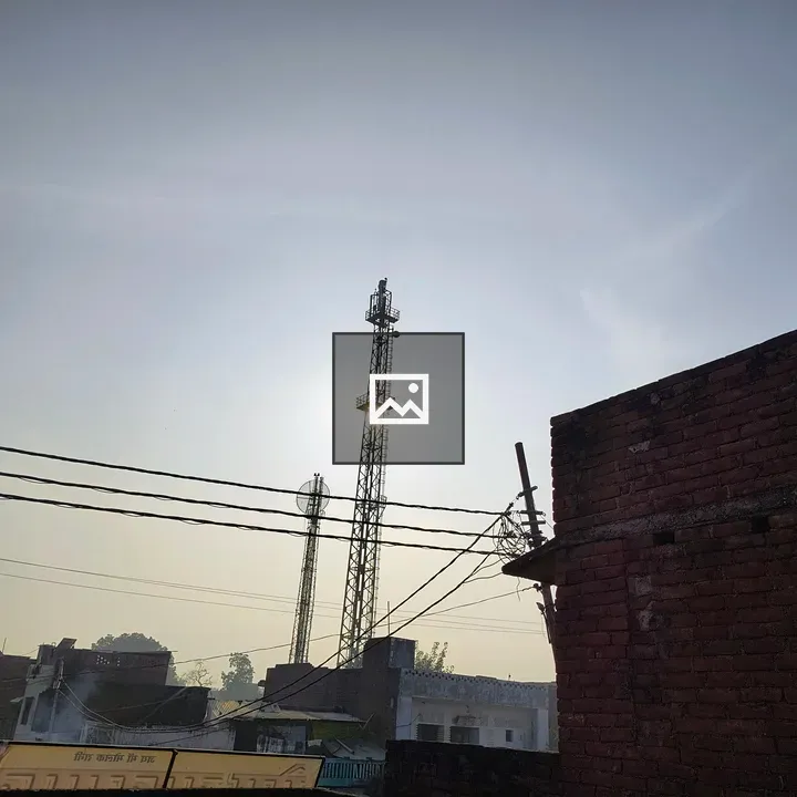 Rooftop silhouette of a network tower