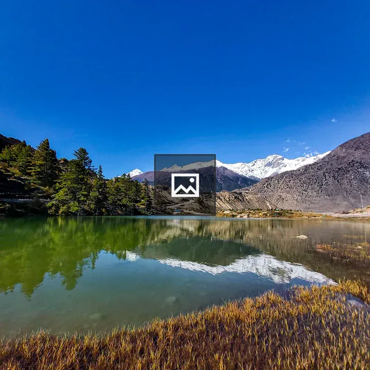 Lake and Snowy Mountain Scene