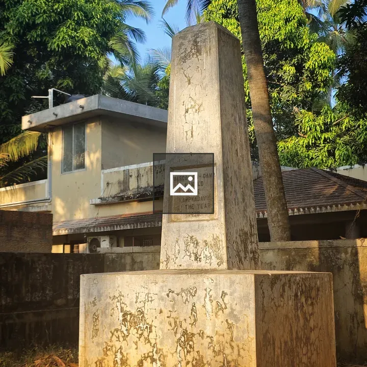 Weathered stone monument in greenery