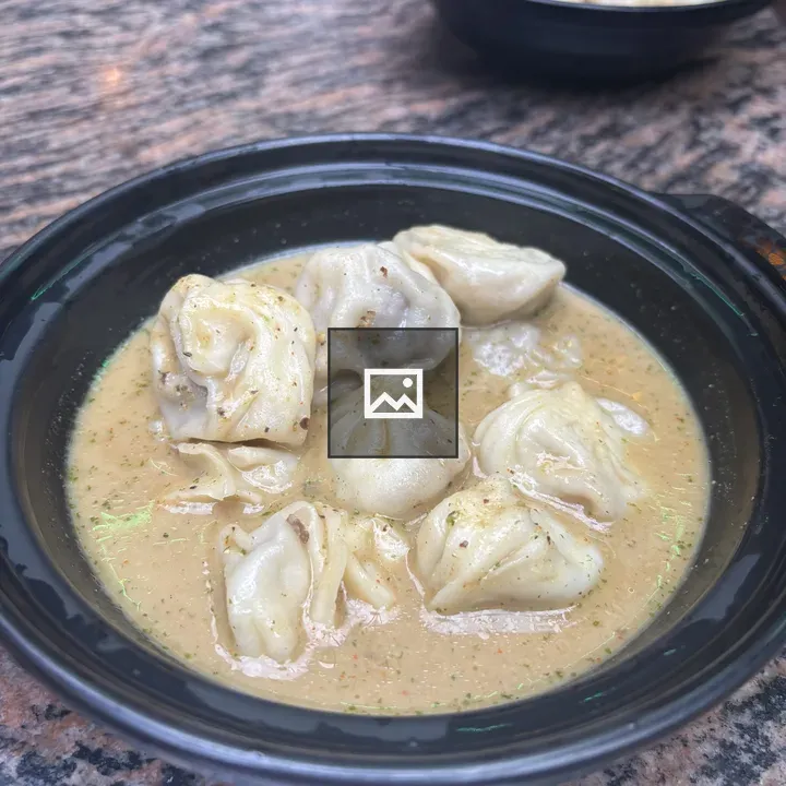 Dumplings in Creamy Sauce