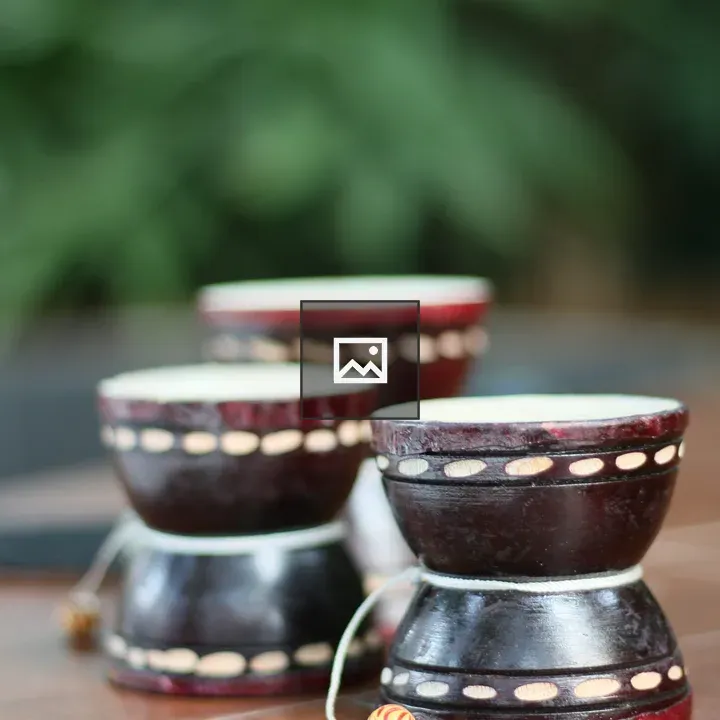 Three small cylindrical drums