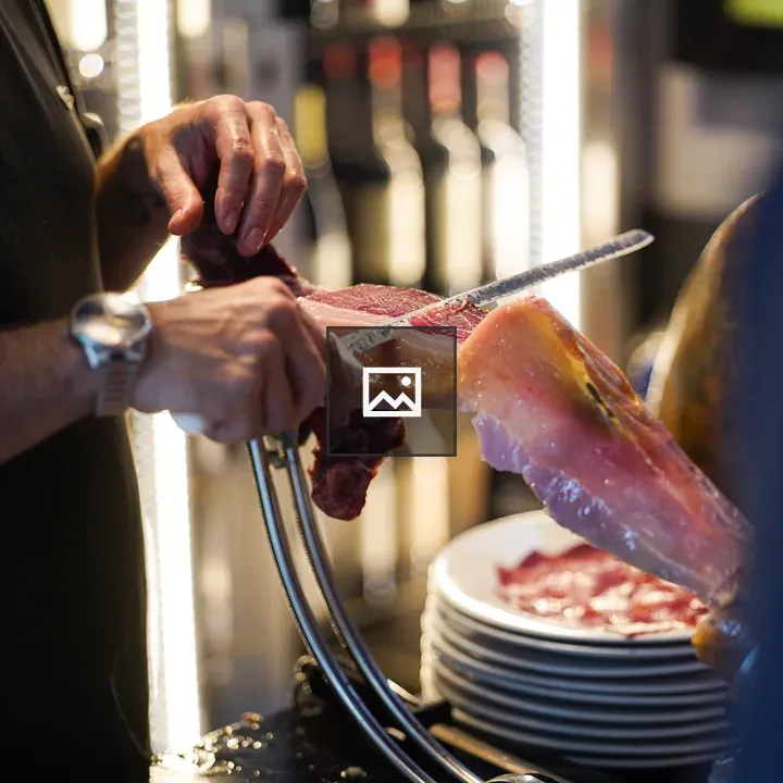 Ibérico meat slicing in kitchen