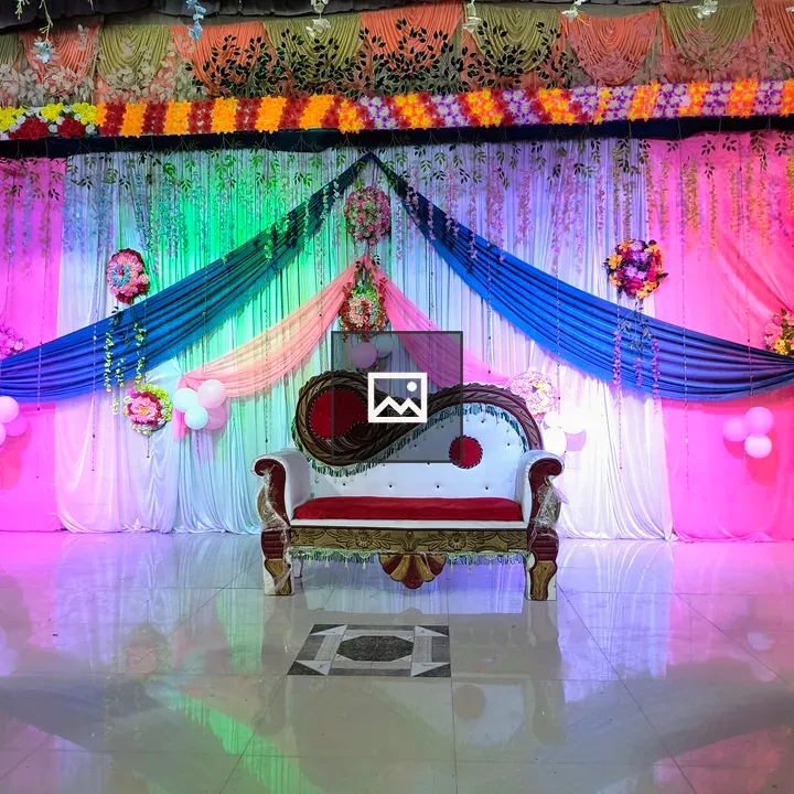 Decorated stage with drapes and sofa