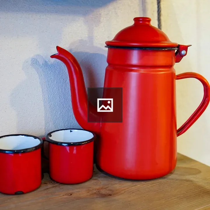 Red enamel kettle with mugs