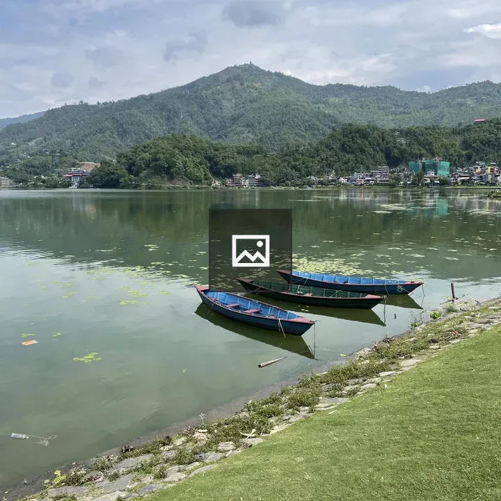 Three boats on Fewa Lake