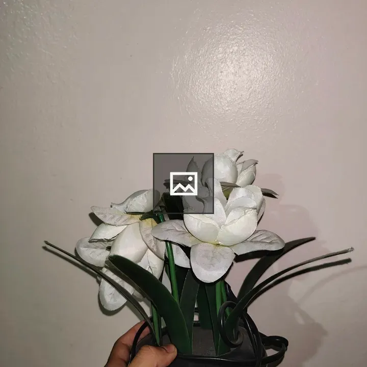 Decorative artificial flower arrangement