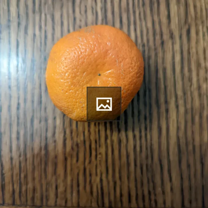 One small orange on a table
