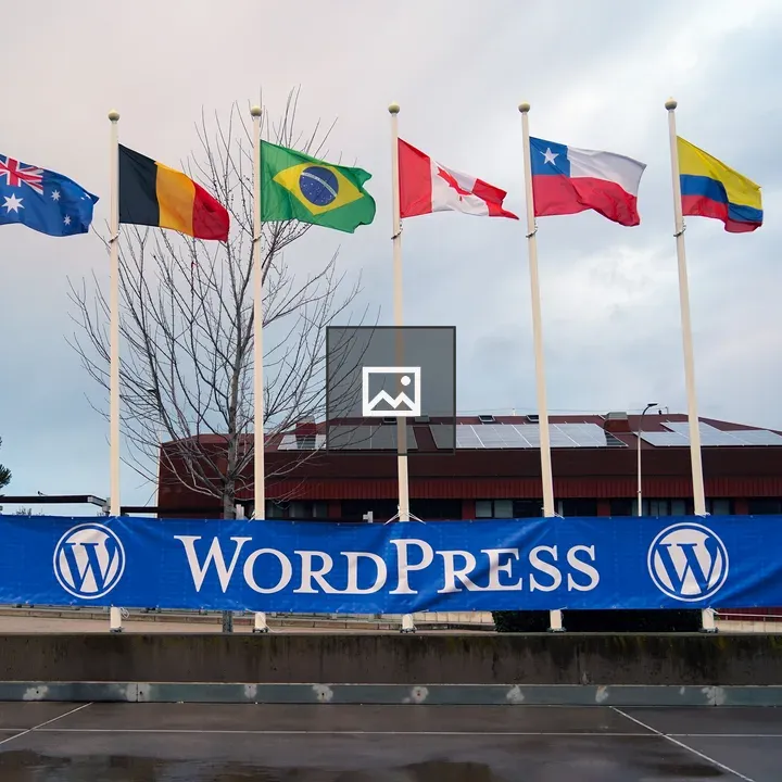 Flags on poles with WordPress banner