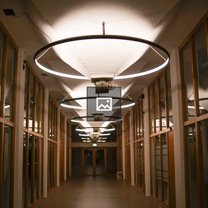 Hallway with glass walls and circular lights
