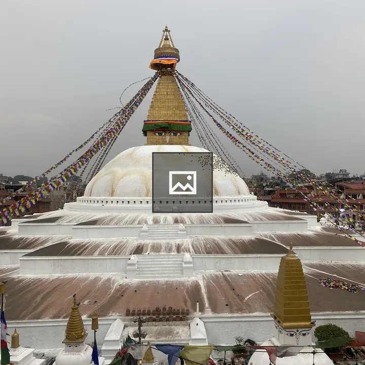 White stupa with prayer flags