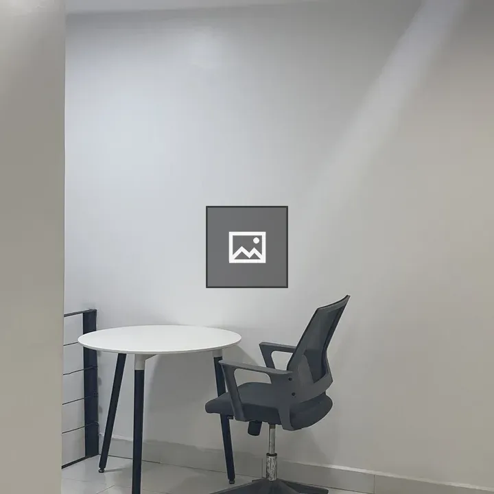 Unoccupied table and chair in co-working space