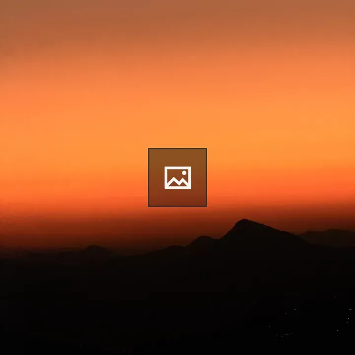 Sunset over Silhouetted Mountains