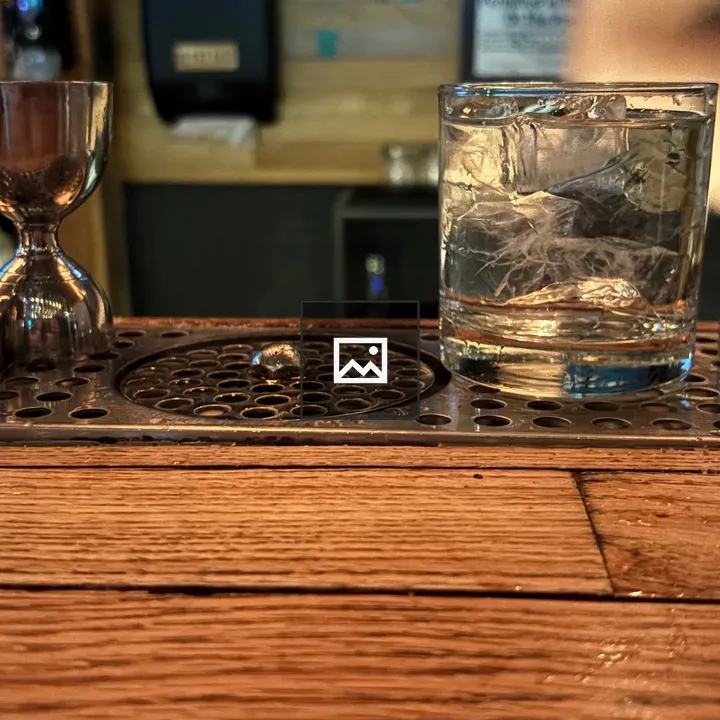 Two Glasses and Jiggers on Bar