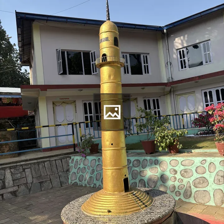 Tall golden tower with spire