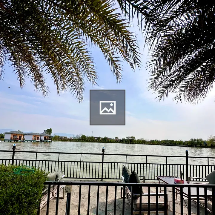 Lakeside seating with fence and chairs