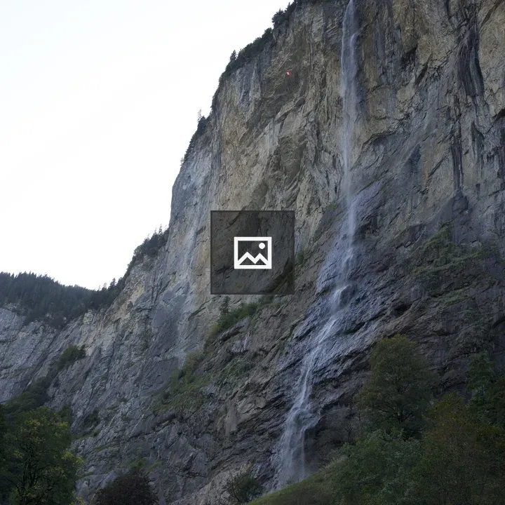 Small mountain waterfall over rocks