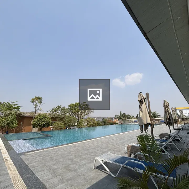 Outdoor infinity pool with lounge chairs