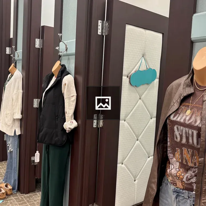 Row of changing rooms with mannequins