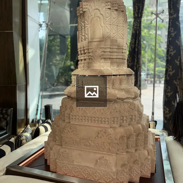 Stone sculpture on wooden table