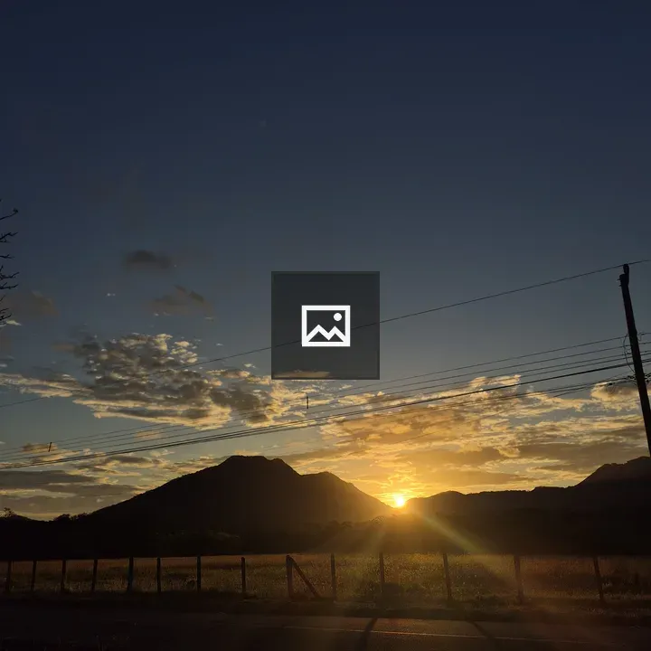 Golden sunset over mountain silhouettes