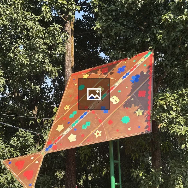 Kite on a Pole amid Trees