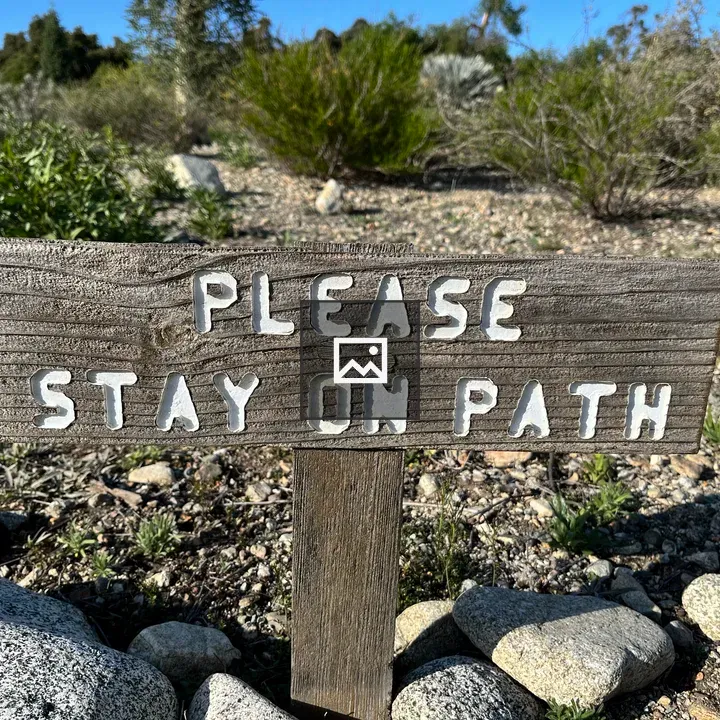 Wooden sign on nature trail