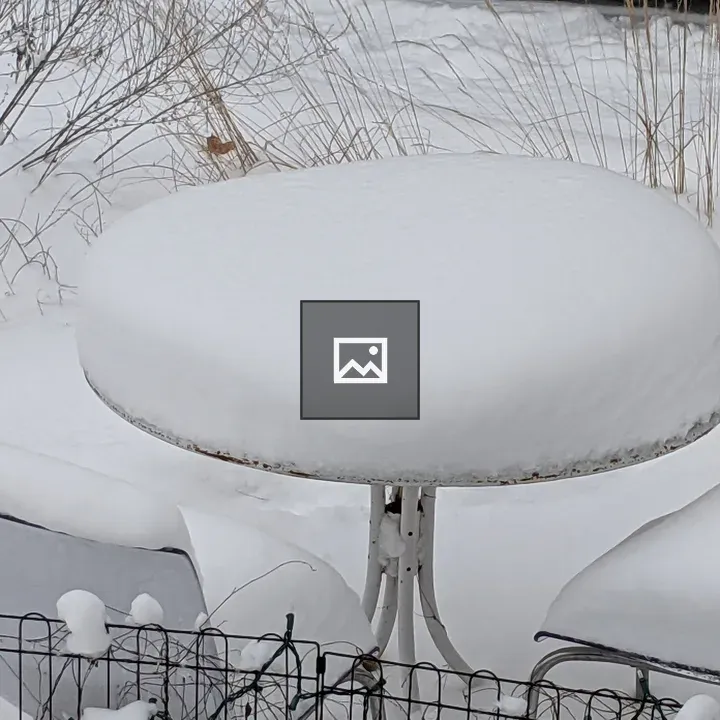 Snow Covered Table and Chairs