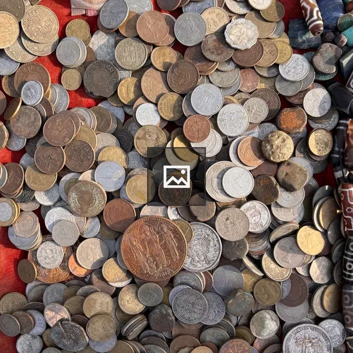Overhead pile of Nepalese coins