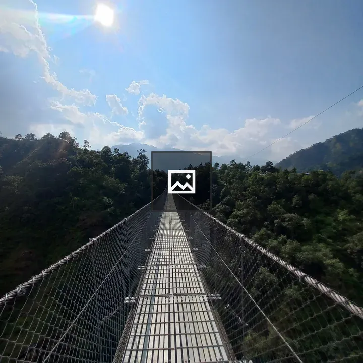 Suspension Bridge Over Green Hills