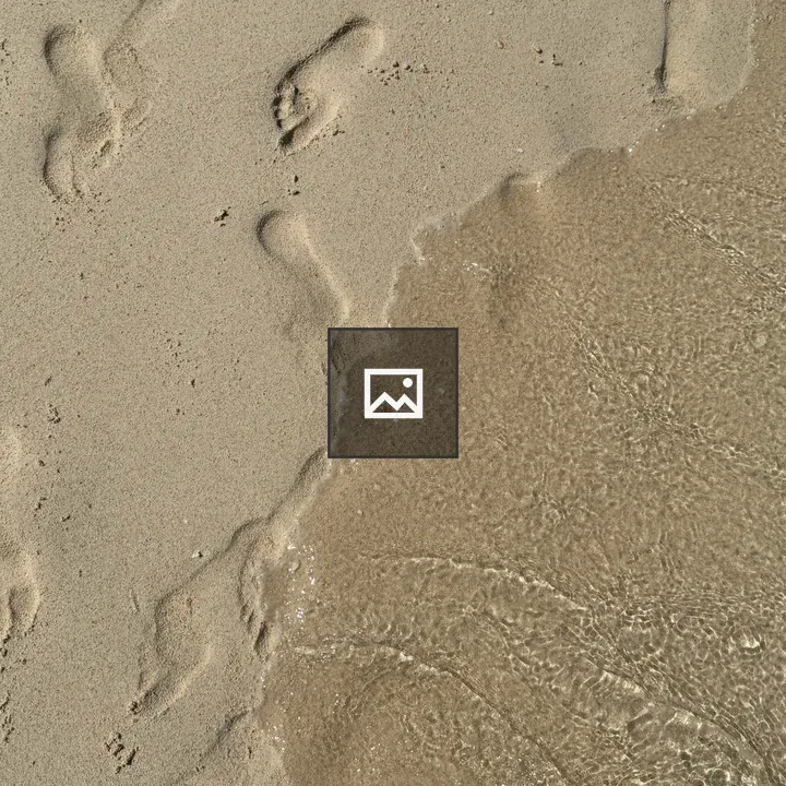 Footprints in Wet Beach Sand