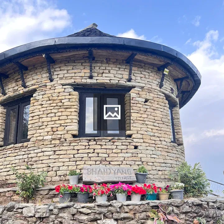 Round stone structure with large windows