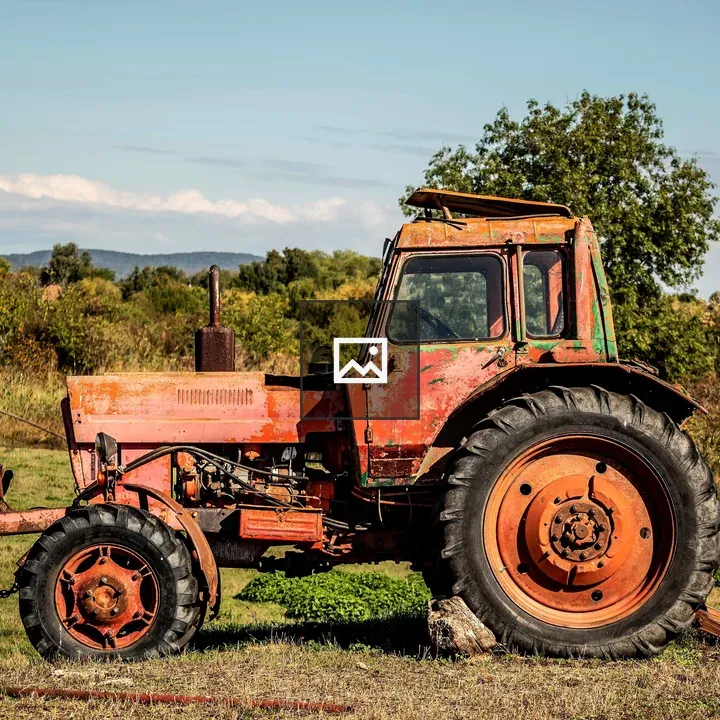 Old rusty tractor in a field