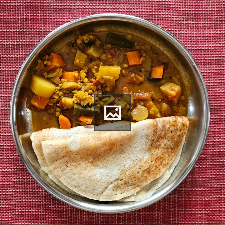 Dosa and Sambar on Table