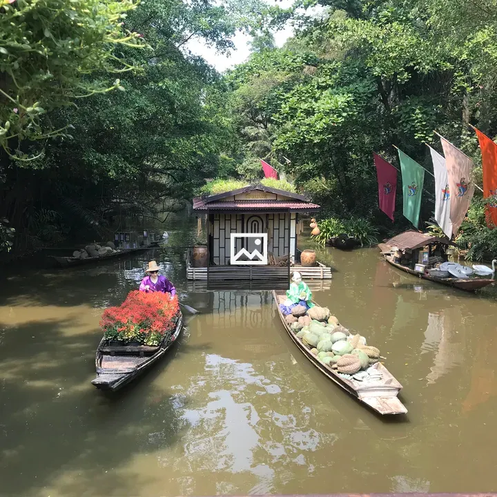 Boats on Calm River with House