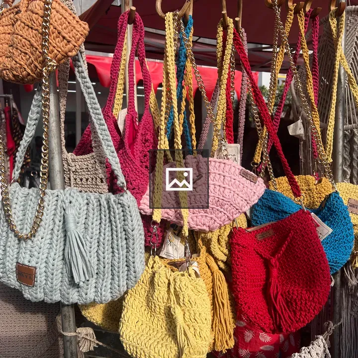 Handbags on wooden rack