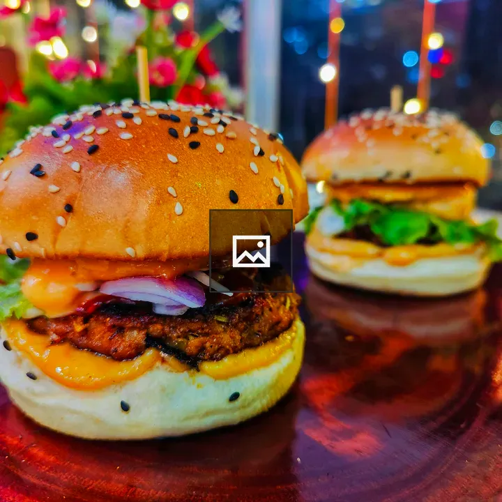 Chicken burger with cheese and greens