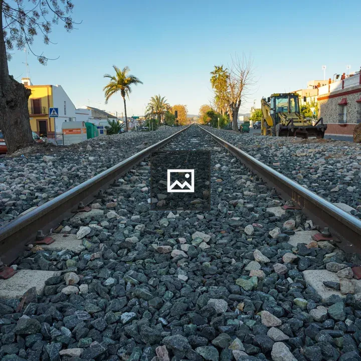Railway tracks with surrounding urban scene