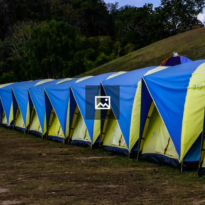 Line of blue and yellow tents