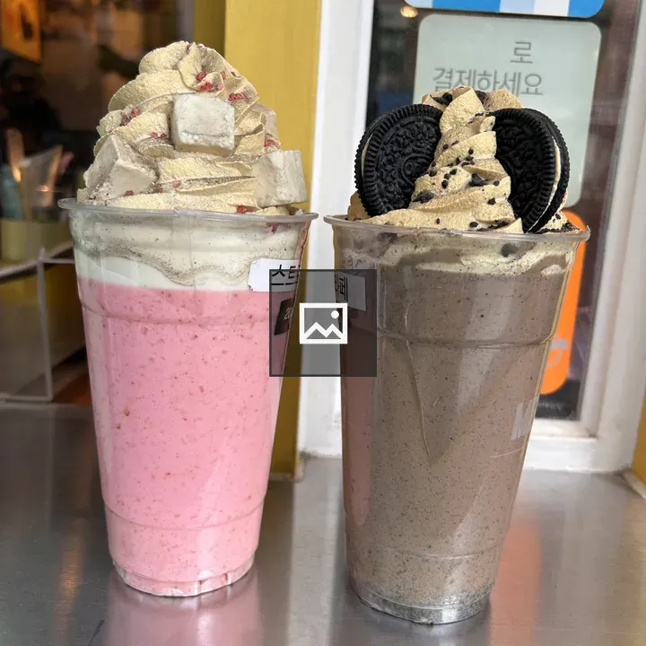 Two Plastic Cups of Blended Beverages