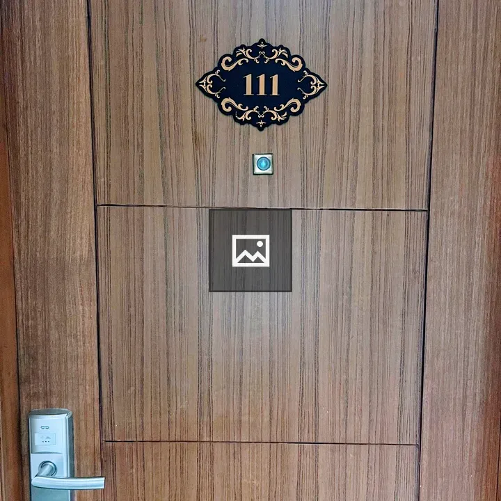 Hotel room door with wood grain