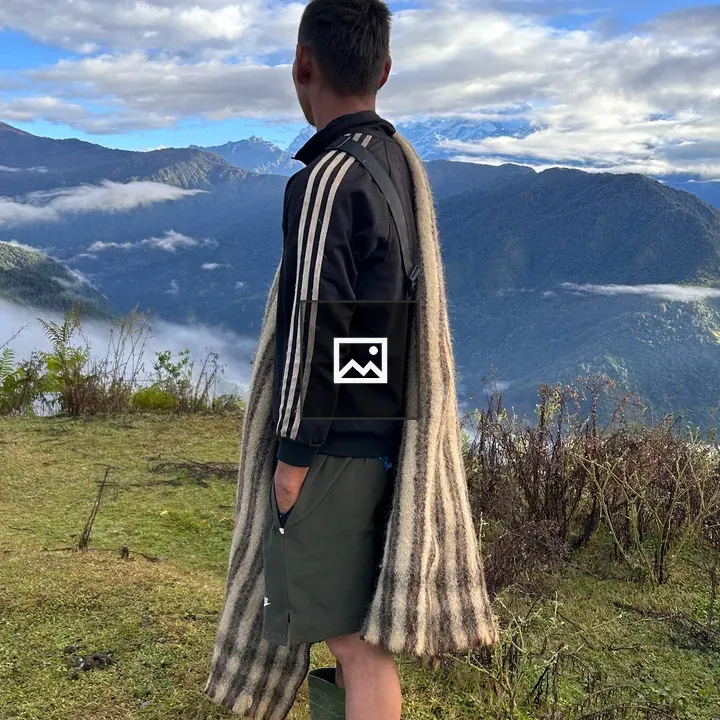 Person on grassy hilltop