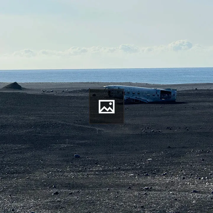 Airplane wreckage by beach
